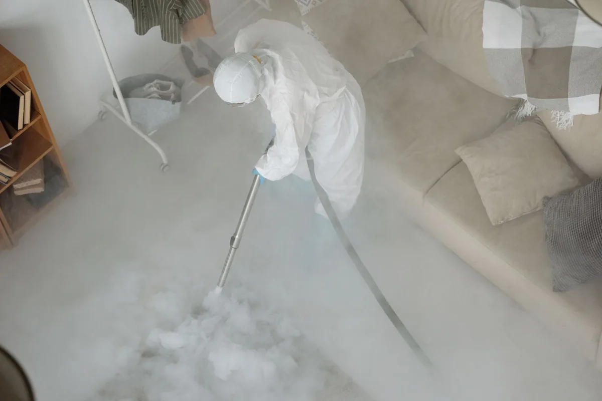 Biohazard cleanup technician in protective equipment, Penn Estates, PA